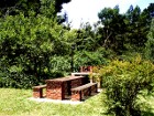 Private BBQ / braai area which is lit at night of Lothlorien Cottage in Hogsback, South Africa