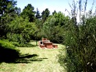 Private BBQ / braai area which is lit at night of Lothlorien Cottage in Hogsback, South Africa